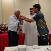 Younis Khan sharing cake with General Manager Sharjah Cricket Club Mr Mazhar Hussain