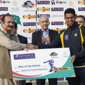 Sports Minister Mr Rana Mashud giving away Man of the Match Cheque to Mohamamd Talha
