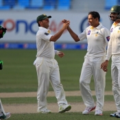 Zulfiqar Babar celebrates the wicket of Mark Craig