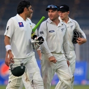 Misbah-ul-Haq and Brendon McCullum going off the field at the end of day one