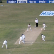Ali Waqas plays a shot against Raza Hasan