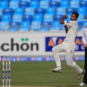 Ehsan Adil about to deliver the  ball
