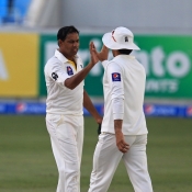 Zulfiqar Babar and Misbah-ul-Haq celebrate the wicket of Tim Southee