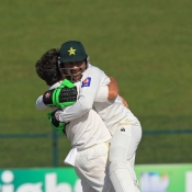 Yasir Shah and Sarfraz Ahmed celebrate the wicket of McCullum