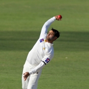 Mohammad Hafeez about to deliver the ball
