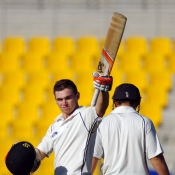 Tom Latham celebrates his maiden Test century