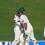 Younis Khan congratulates Misbah for his fifty