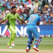 Sohail Khan celebrates the wicket of Rahane