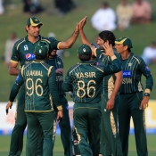 Sohail Tanvir celebrates the wicket of Guptill