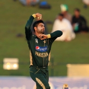 Ahmed Shehzad about to deliver the ball