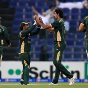 Mohammad Irfan celebrates the wicket of Taylor