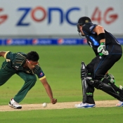Raza Hasan tries to stop the ball in his follow through
