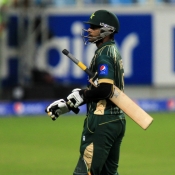 Mohammad Hafeez going back towards pavillion after getting run out