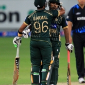 Umar Akmal and Sarfraz Ahmed celebrate after winning the 1st T20
