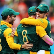 Steyn and AB celebrate the wicket of Ahmed Shehzad
