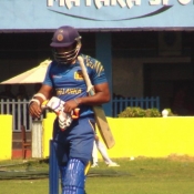 Sri Lanka A batsman walking back towards the pavilion