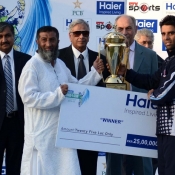 Taufeeq Umar receives the winning trophy of the tournament