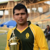 NBP captain Kamran Akmal poses with the runners-up QEA Trophy Gold
