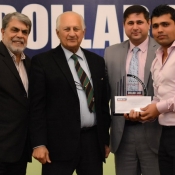 Kamran Akmal receives a medal from Chairman PCB Mr. Shaharyar M. Khan in a program organized by local cricket team