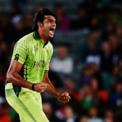 Mohammad Irfan celebrates the wicket of Dumminy