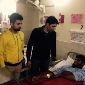 Ahmed Shehzad and Misbah-ul-Haq meet injured Army Public School Peshawar student at CMH