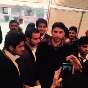 Misbah-ul-Haq poses with the students of Army Public School Peshawar