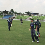 Saeed Ajmal and Mohammad Hafeez warm up during practice session