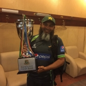 Mushtaq Ahmed poses with the trophy