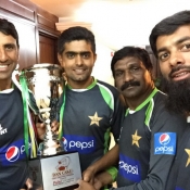 Younis Khan and Babar Azam pose with the Trophy