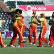 Imran Khan celebrates the wicket with his teammates