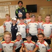 Mohammad Irfan poses with the young Australian fans at Raby Sporting Complex, Australia
