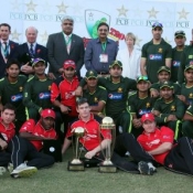 Group photo of PCB XI and British XI teams at Pindi Cricket Stadium