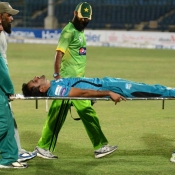 Akhtar Ayub is being taken to hospital for medical treatment after he slipped in his follow through