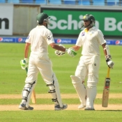 Younis Khan congratulates Azhar Ali for his fifty on day one of 1st Test between Pakistan and Australia at Dubai