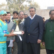 Member PCB Governing Board Shakil Shaikh giving away winning trophy of PCB Pepsi Cricket Stars U-16 One Day Tournament to Captain of Rawalpindi Region