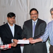 Chairman PCB Mr. Zaka Ashraf giving away the cash award to lower grade employees
