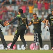 Zulfiqar Babar of Pakistan celebrates with his teammates after dismissing Shane Watson of Australia