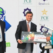 Rawalpindi captain Babar Naeem lifts the QEA Trophy 2013/14