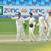 Pakistan team celebrates after taking the wicket of Peter Siddle on the final day of the 1st Test at Dubai