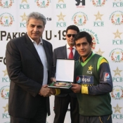 Director International Cricket Oprations PCB Zakir Khan giving away the man of the match award to Pakistan Under-19s Sajawal Riaz