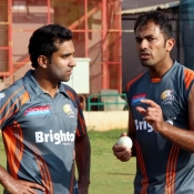 Wahab Riaz giving tips to Asif Raza in practice session at M Chinnaswamy Stadium, Bangalore