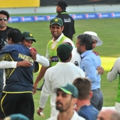 Waqar Younis hugs Zulfiqar Babar after winning the 1st Test against Australia at Dubai
