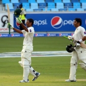 Younis Khan celebrates his century on day one of 1st Test between Australia and Pakistan at Dubai