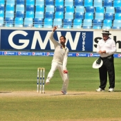Zulfiqar Babar about to delivers the ball on the final day of the 1st Test at Dubai