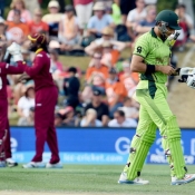 West Indies players celebrate the wicket of Misbah-ul-Haq