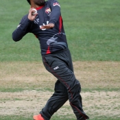 Mohammad Naveed about to deliver the ball