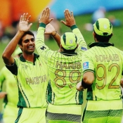 Rahat celebrates the wicket with his teammates
