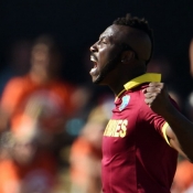 Andre Russell celebrates the wicket of Wahab Riaz
